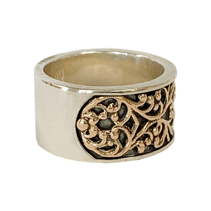 Sterling silver wide ring with a 14-karat rose gold filigree pattern