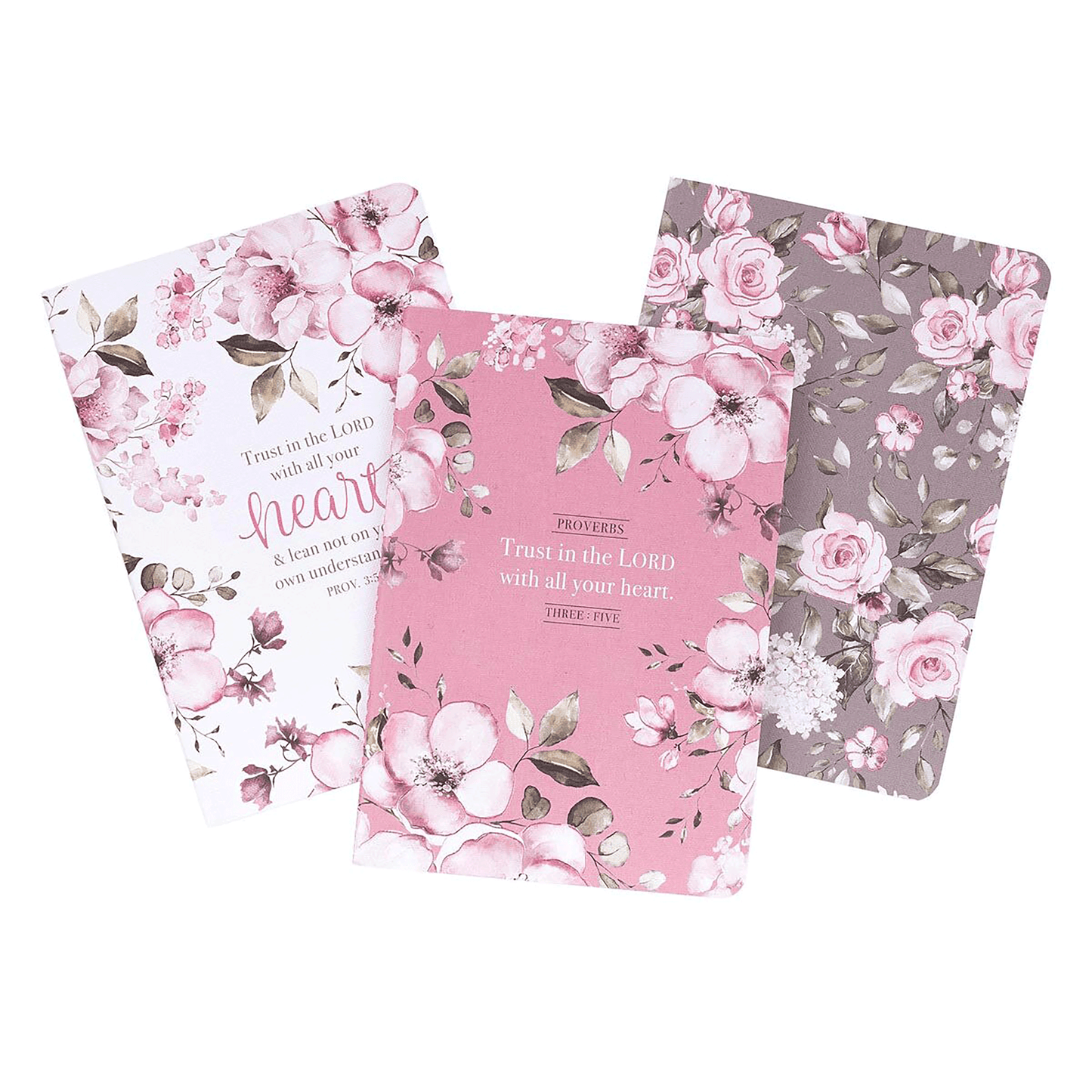 A set of three notebooks: white, pink and brown. Each displays a blush pink floral design, and two of the three have the Scripture “Trust in the LORD” on the front.