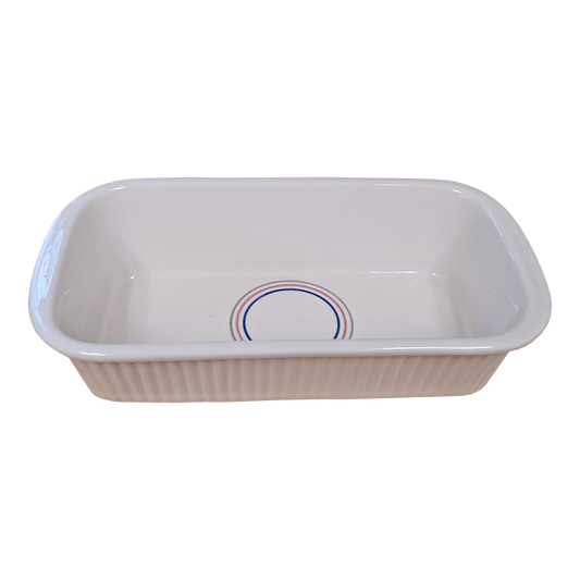 Soft-white rectangular dish made of Lapid stoneware with a multicolored circular design in the bottom of the dish 