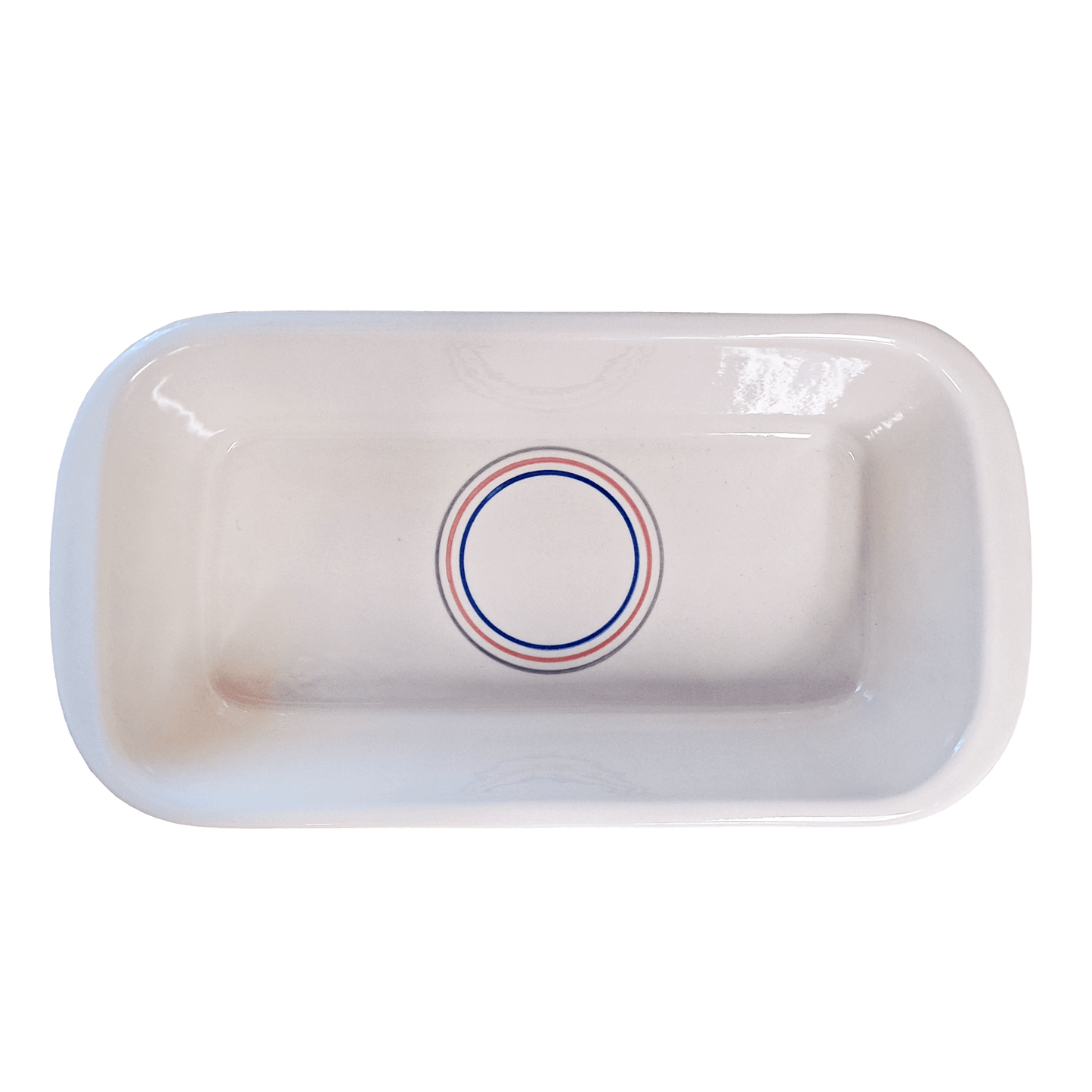 Soft-white rectangular dish made of Lapid stoneware with a multicolored circular design in the bottom of the dish 