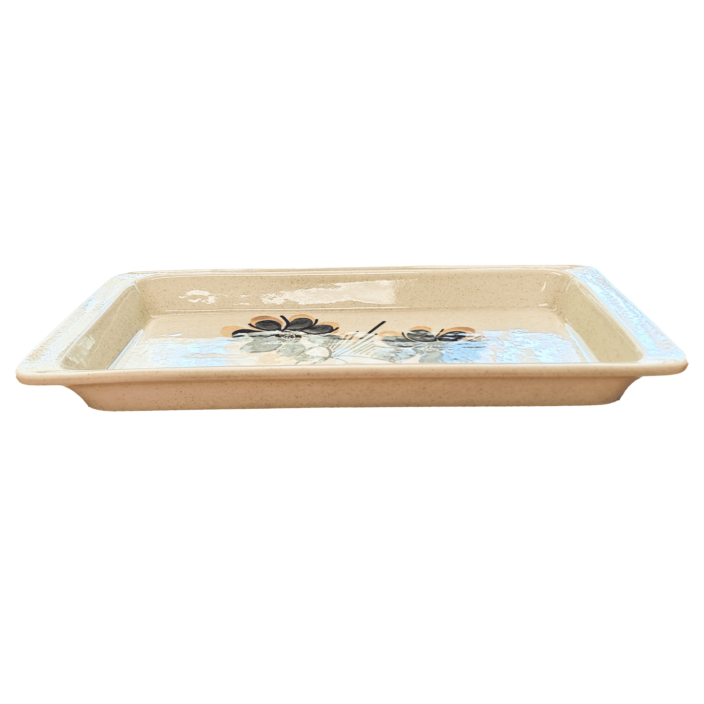 Rectangular speckled cream serving tray made of Lapid stoneware with a dark blue and yellow floral design in the bottom of the dish