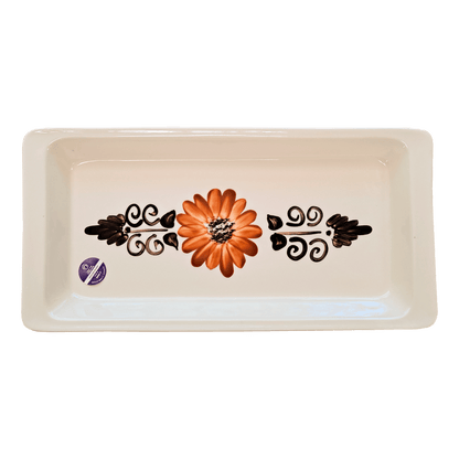 Soft-white rectangular serving tray made of Lapid stoneware with an orange and brown long petaled floral design in the bottom of the dish