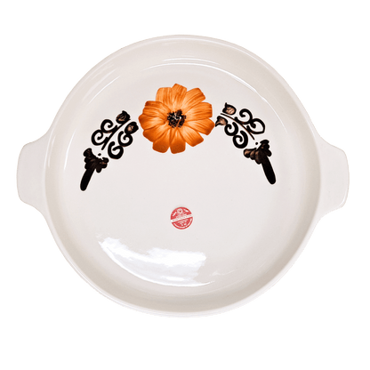 Soft-white circular dish made of Lapid stoneware with an orange and brown floral design in the bottom of the dish