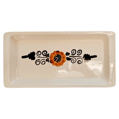 Soft-white rectangular serving tray made of Lapid stoneware with an orange and brown short petaled floral design in the bottom of the dish