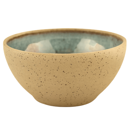 Handcrafted ceramic deep teal and sand-colored bowl