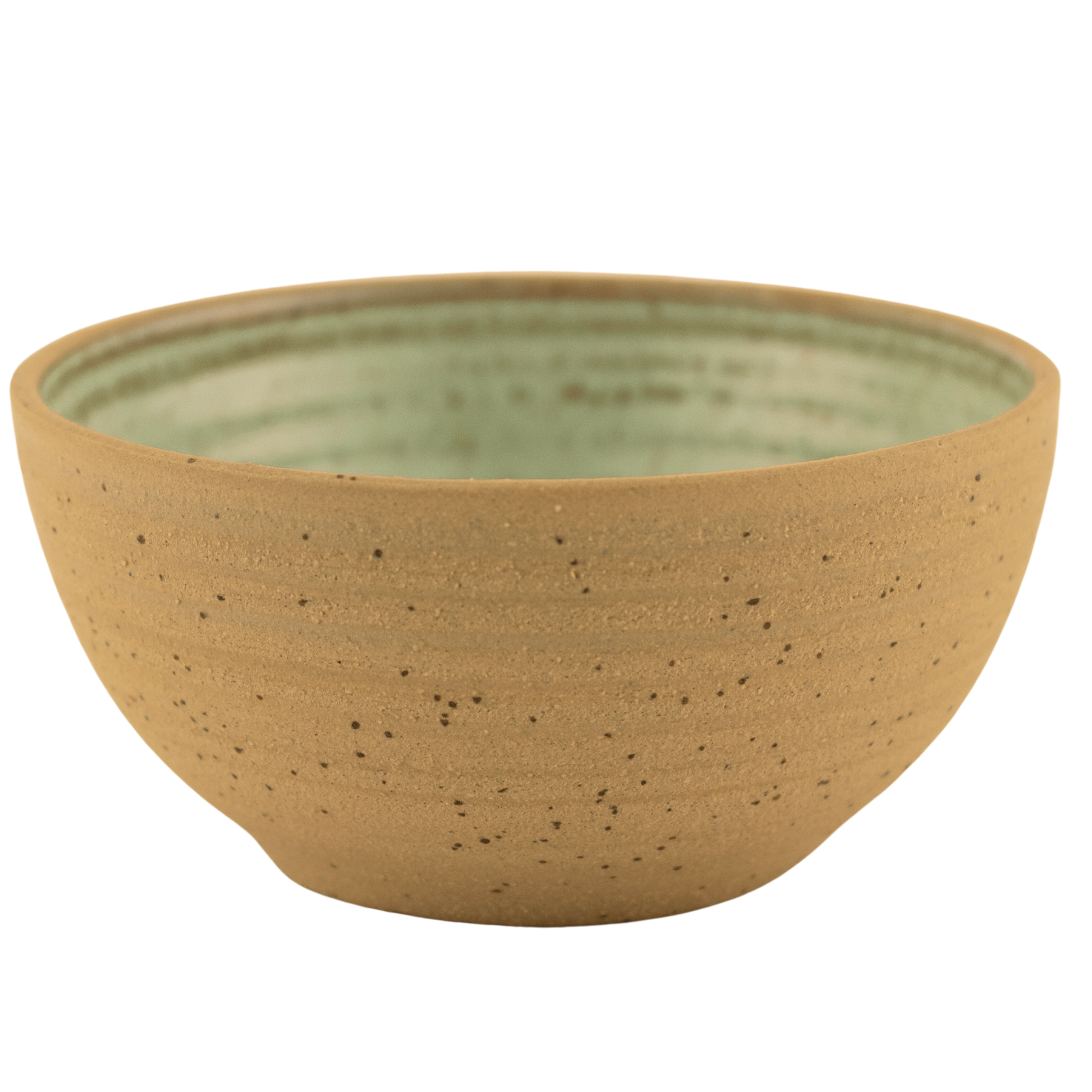 Handcrafted ceramic seafoam green and sand-colored bowl