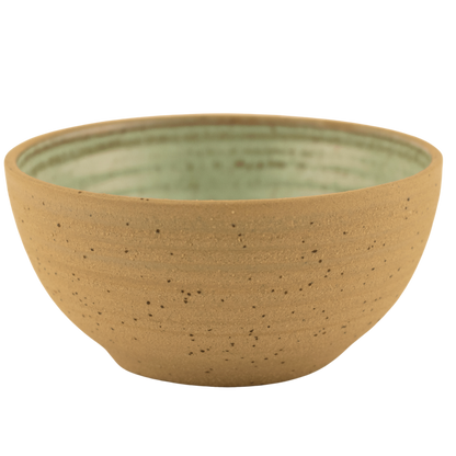 Handcrafted ceramic seafoam green and sand-colored bowl