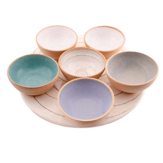 Multicolored ceramic serving set; includes six small bows and a serving tray