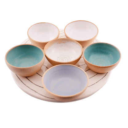 Multicolored ceramic serving set; includes six small bows and a serving tray