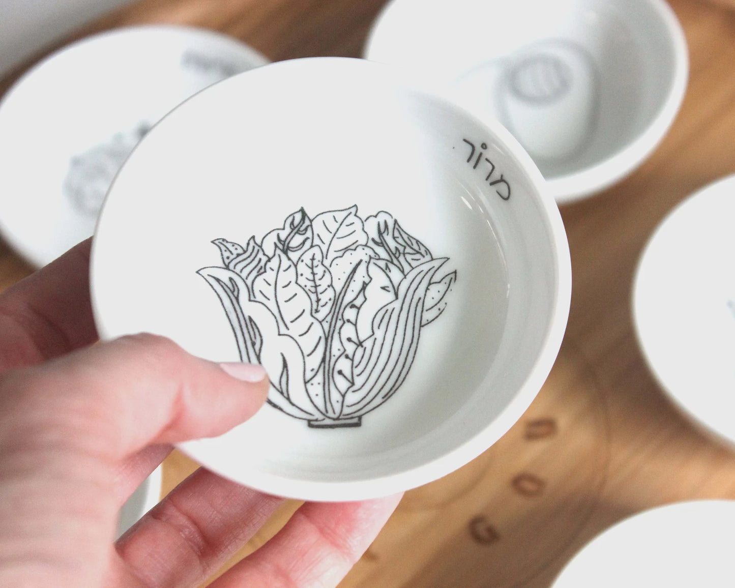 Porcelain bowl with a black and white illustration of lettuce