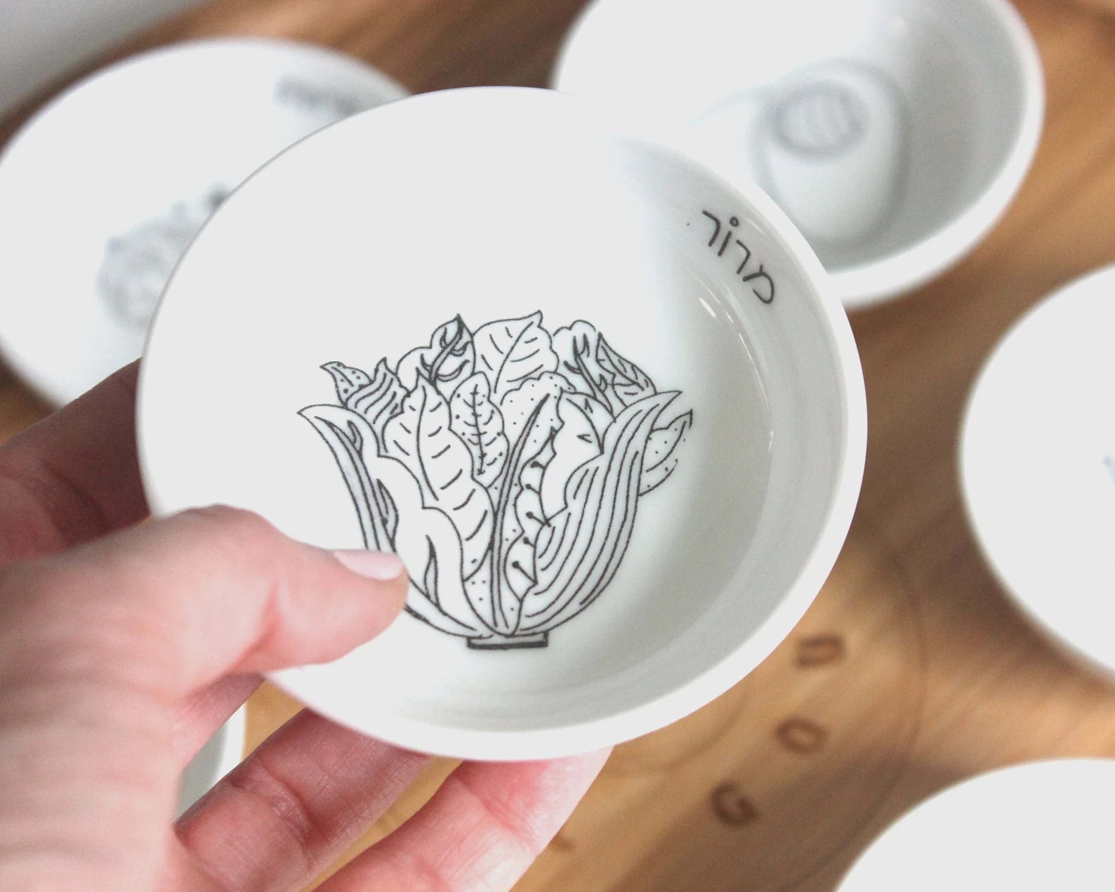 Porcelain bowl with a black and white illustration of lettuce