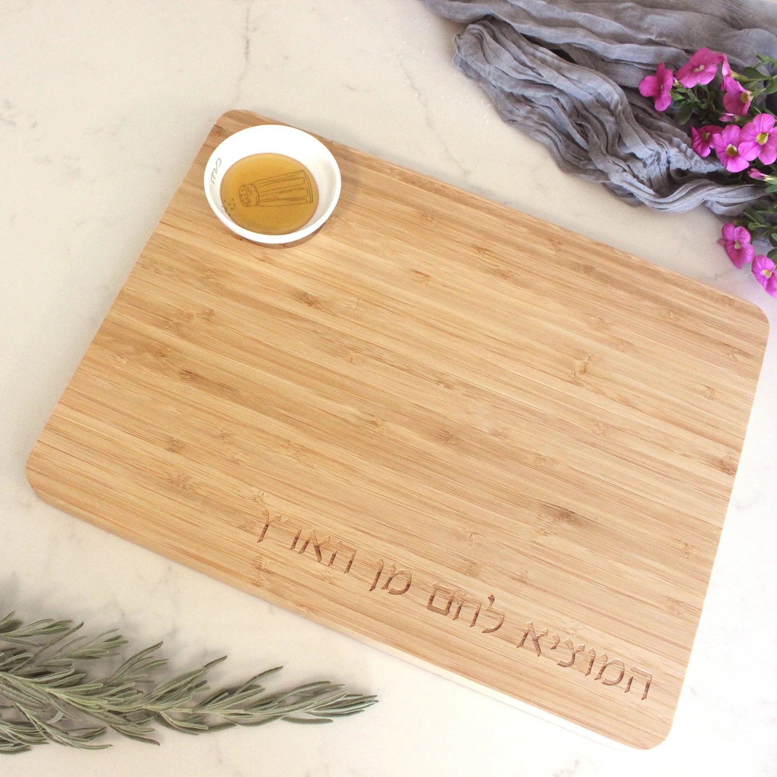 Bamboo Challah Board with a porcelain bowl which features and illustration of a blue an white salt shaker with honey in the bowl