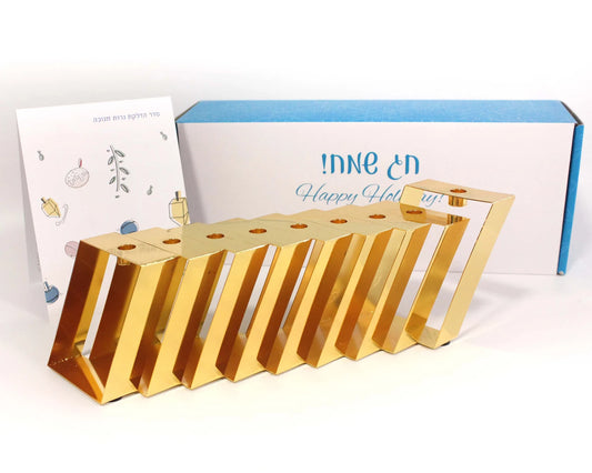 Gold Hanukkiah with its packaging in the background