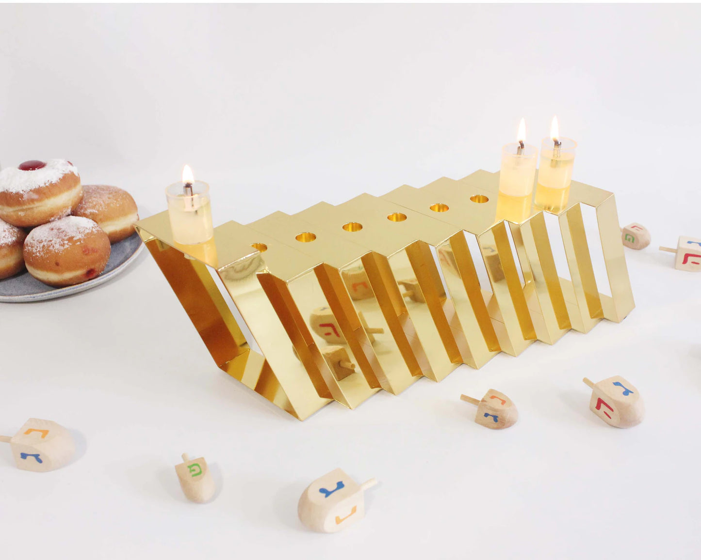 Gold Hanukkiah with three lit candles