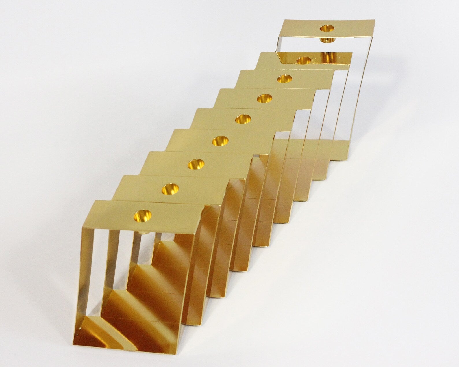 Top view of a gold Hanukkiah