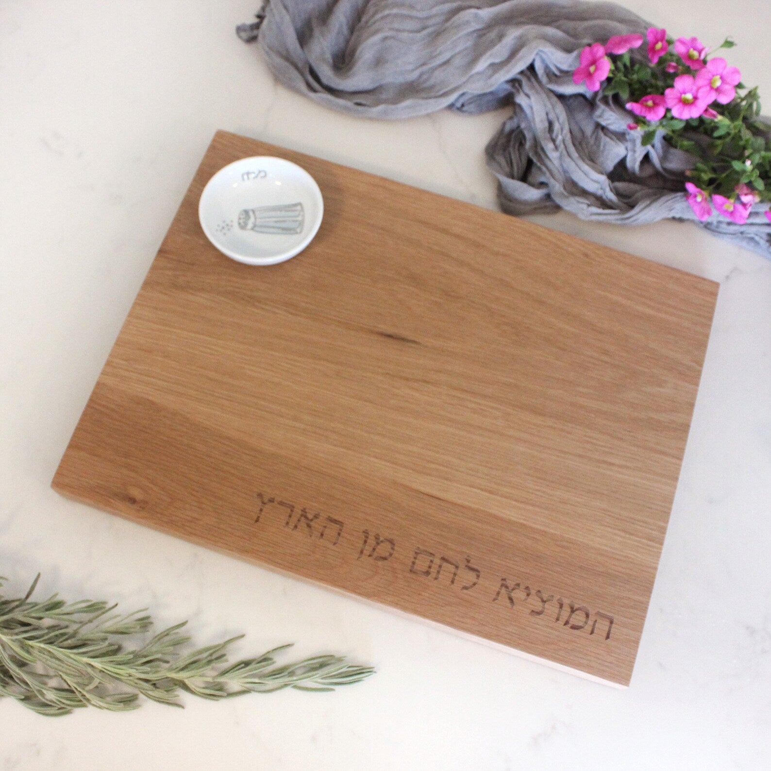 Oak Challah Board with a porcelain bowl which features an illustration of a blue and white salt shaker