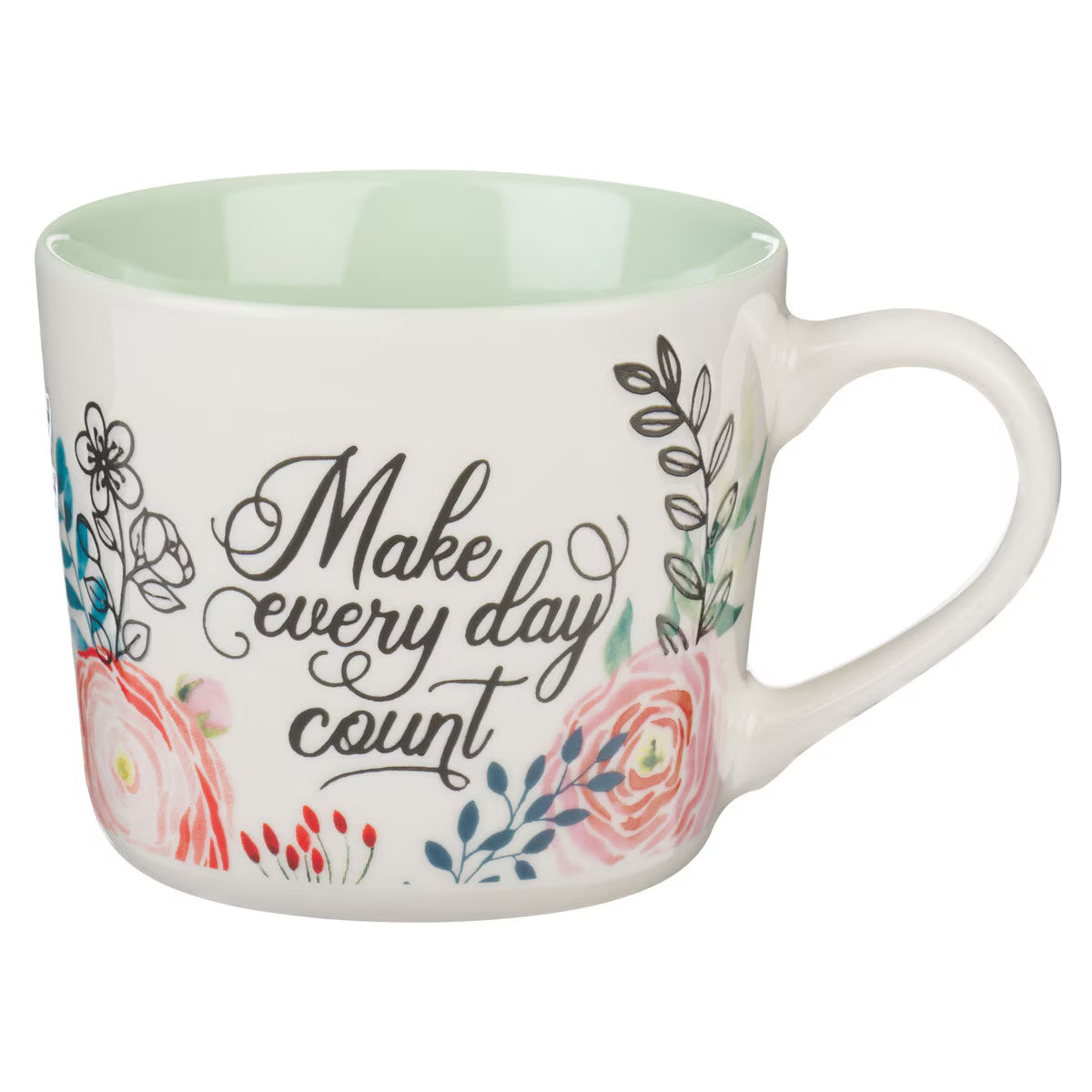 White floral mug with green interior and motivational quote in white script