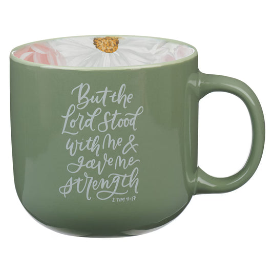 Green mug with floral interior and motivational quote in white script
