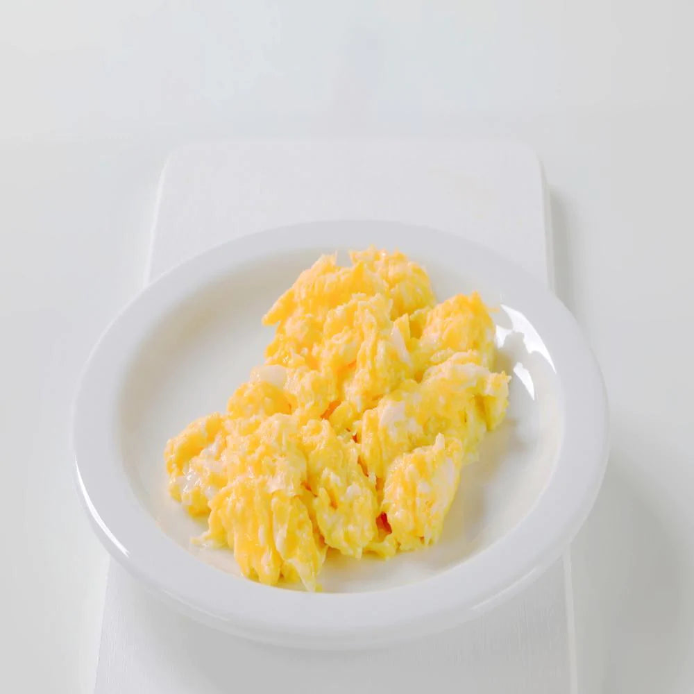 scrambled egg on white plate with white background 