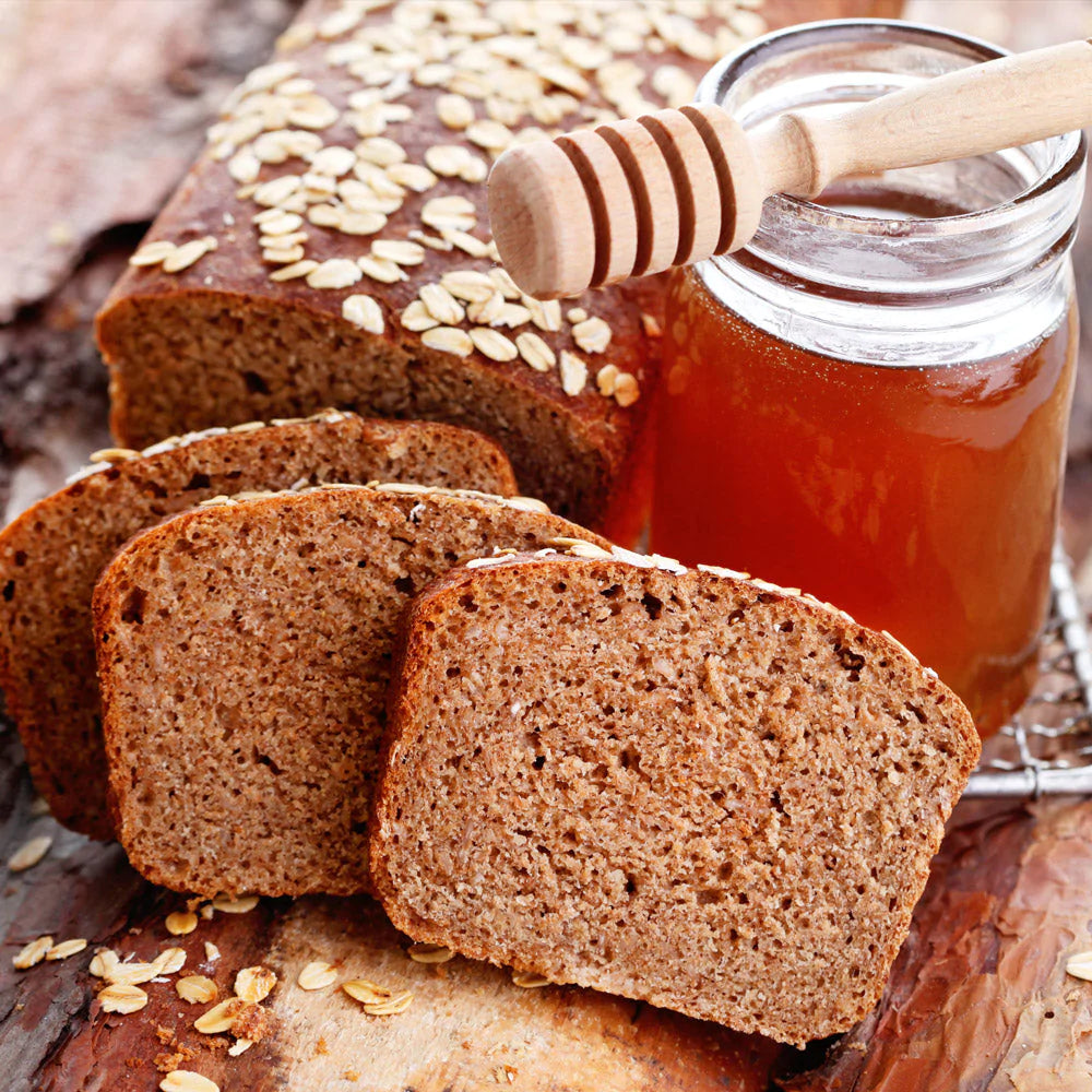 honey wheat loaf and jar of honey