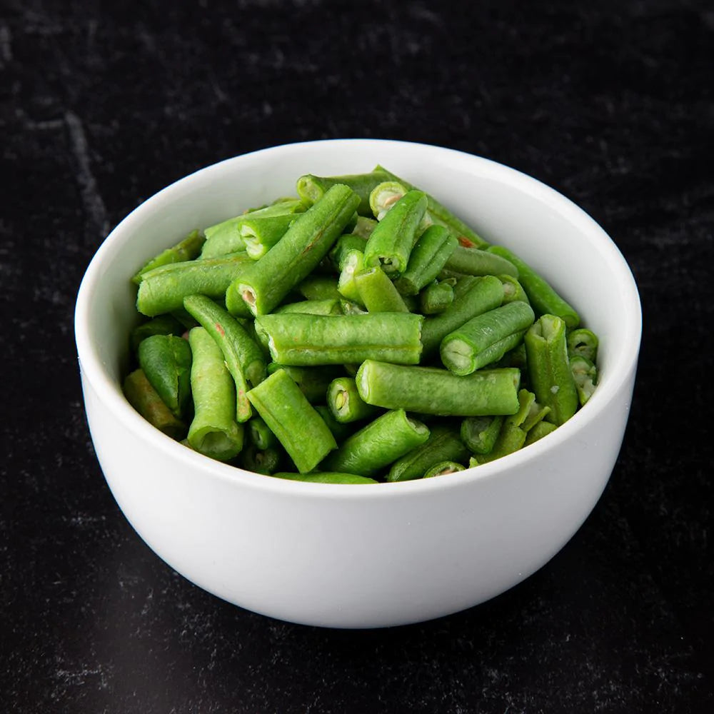 freeze dried green beans in white bowl