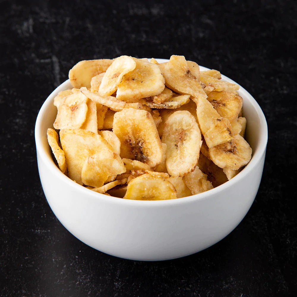 banana chips in white bowl 