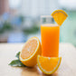 orange energy drink in tall glass with sliced orange on glass and oranges on the side of glass
